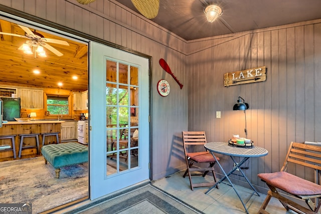 185 Pope Dickson Ln, Clarkesville, GA 30523 - doorway to outside with ceiling fan and wooden walls