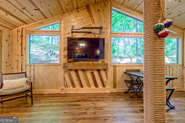 185 Pope Dickson Ln, Clarkesville, GA 30523 - living area with lofted ceiling, wooden walls, wood ceiling, healthy amount of natural light, and hardwood / wood-style flooring