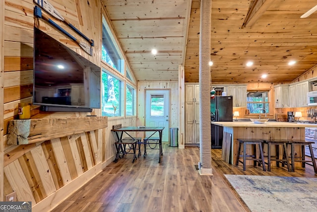 185 Pope Dickson Ln, Clarkesville, GA 30523 - kitchen with white appliances, white cabinets, a breakfast bar, wooden ceiling, and healthy amount of natural light