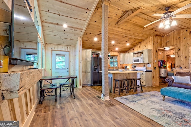 185 Pope Dickson Ln, Clarkesville, GA 30523 - living area with lofted ceiling, wooden walls, wood ceiling, ceiling fan, and light wood-style floors
