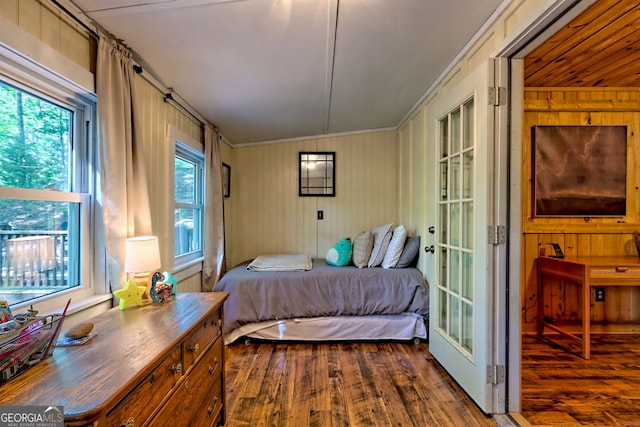 185 Pope Dickson Ln, Clarkesville, GA 30523 - bedroom featuring dark wood-type flooring, wood walls, and ornamental molding