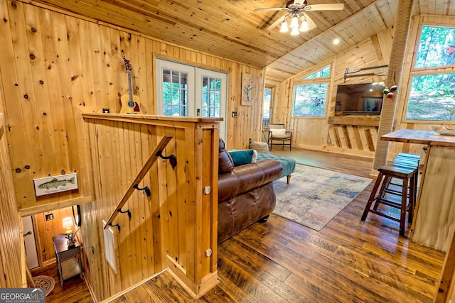 185 Pope Dickson Ln, Clarkesville, GA 30523 - living area with wooden walls, wood ceiling, vaulted ceiling, wood-type flooring, and ceiling fan