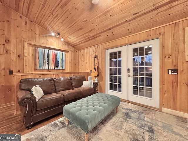 living room featuring wooden walls, wood ceiling, baseboards, vaulted ceiling, and french doors