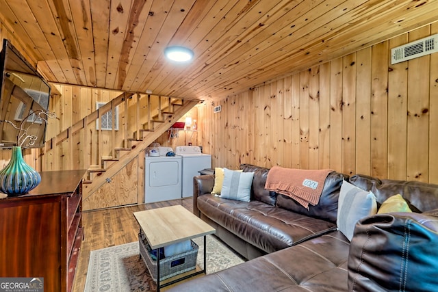 185 Pope Dickson Ln, Clarkesville, GA 30523 - living room featuring washer and dryer, stairs, wooden walls, wood finished floors, and wood ceiling