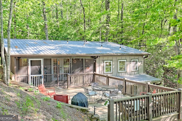 185 Pope Dickson Ln, Clarkesville, GA 30523 - rear view of house featuring a metal roof, a wooden deck, and a patio area