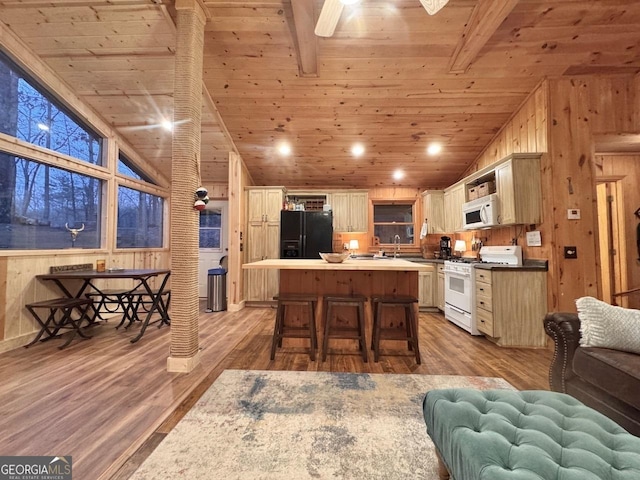 kitchen featuring wooden ceiling, lofted ceiling with beams, open floor plan, wood finished floors, and white appliances