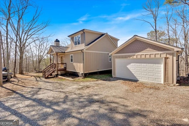 view of property exterior with an outbuilding, an attached garage, a chimney, and dirt driveway