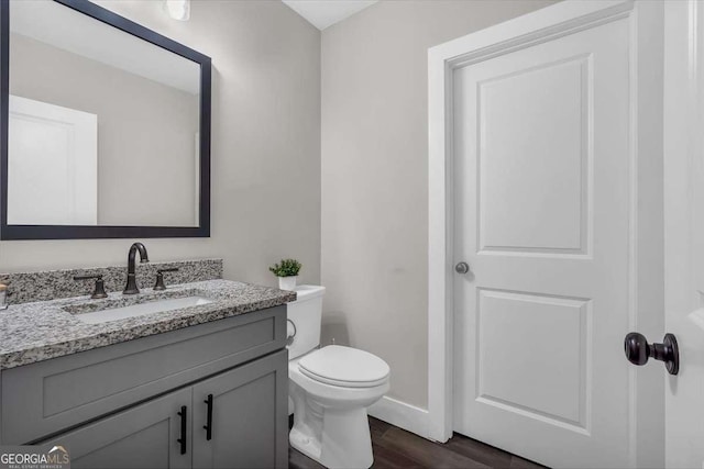 1172 Hunter Dr, Ranger, GA 30734 - half bath featuring vanity, wood finished floors, toilet, and baseboards