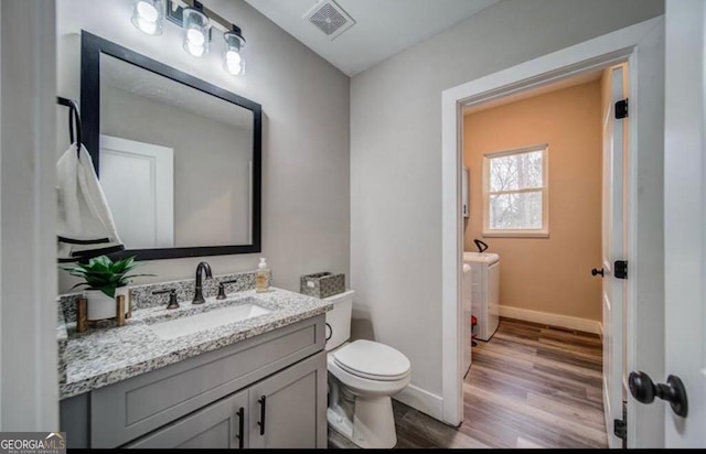 1172 Hunter Dr, Ranger, GA 30734 - half bath with separate washer and dryer, wood finished floors, vanity, toilet, and baseboards