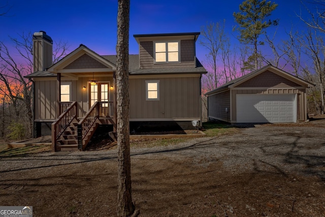 1172 Hunter Dr, Ranger, GA 30734 - view of front of house with a porch, a garage, a chimney, board and batten siding, and stairway