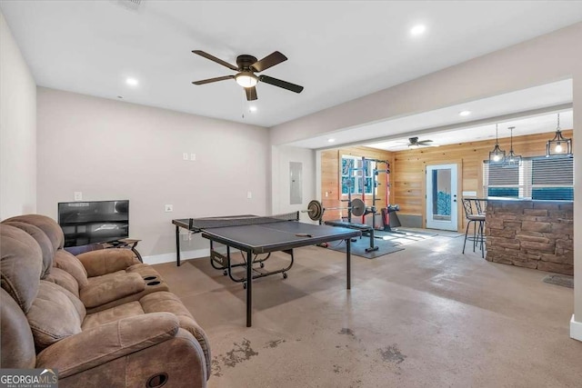 1172 Hunter Dr, Ranger, GA 30734 - playroom featuring a ceiling fan, electric panel, recessed lighting, wood walls, and concrete flooring