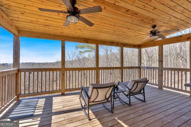 wooden terrace featuring ceiling fan