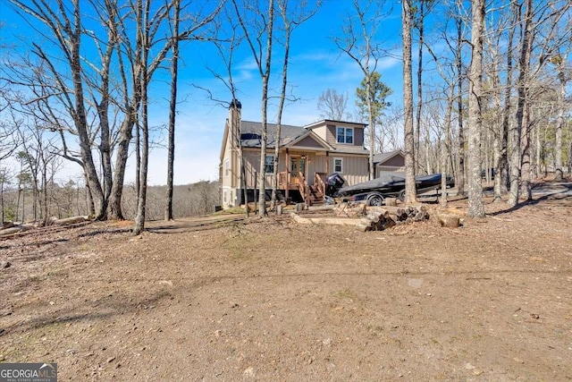 1172 Hunter Dr, Ranger, GA 30734 - view of front facade with a chimney, board and batten siding, and a wooden deck
