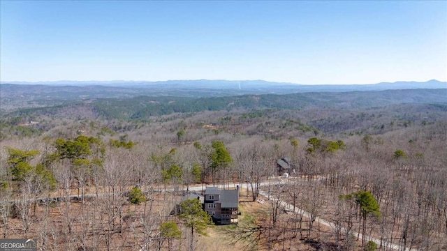 view of mountain feature featuring a forest view