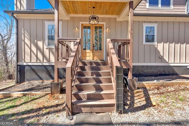 entrance to property with board and batten siding and french doors