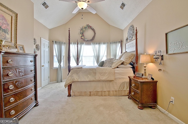 bedroom with a textured ceiling, carpet, and visible vents