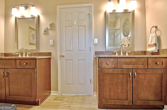 full bath with two vanities and a sink