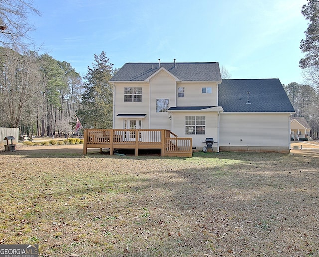 back of property featuring a shingled roof, crawl space, a lawn, and a wooden deck