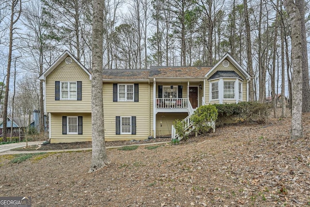 view of front of home with covered porch and stairway