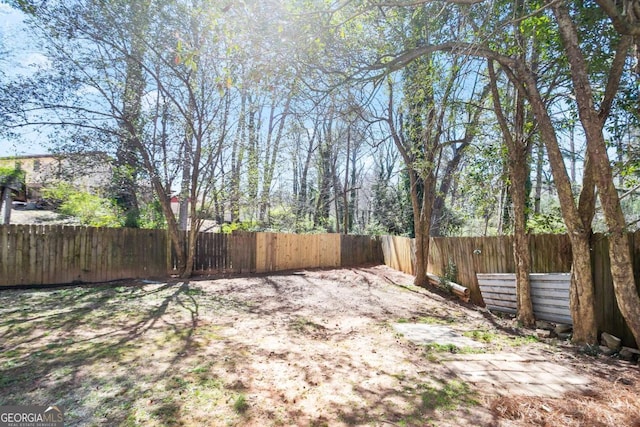 view of yard with a fenced backyard