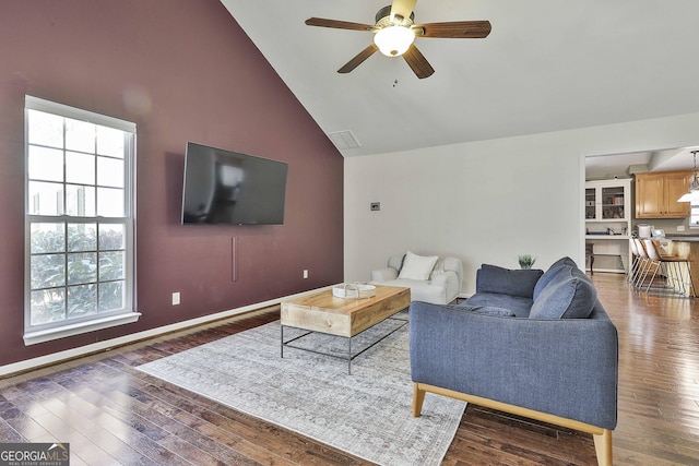 living area featuring high vaulted ceiling, wood finished floors, visible vents, and ceiling fan