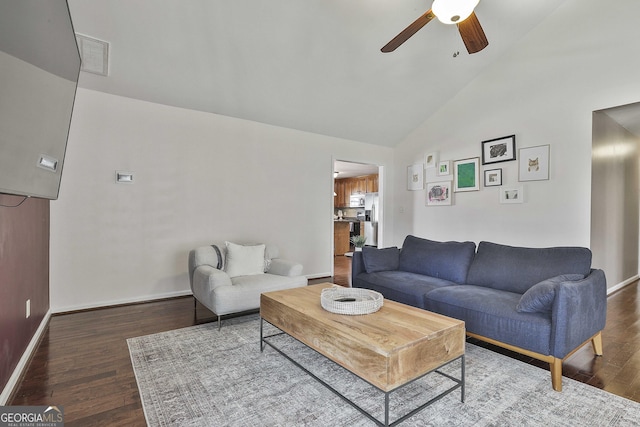 living room featuring visible vents, baseboards, ceiling fan, and wood finished floors