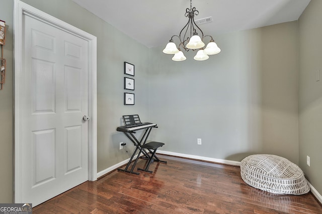 dining space featuring visible vents, a notable chandelier, dark wood-style floors, and baseboards