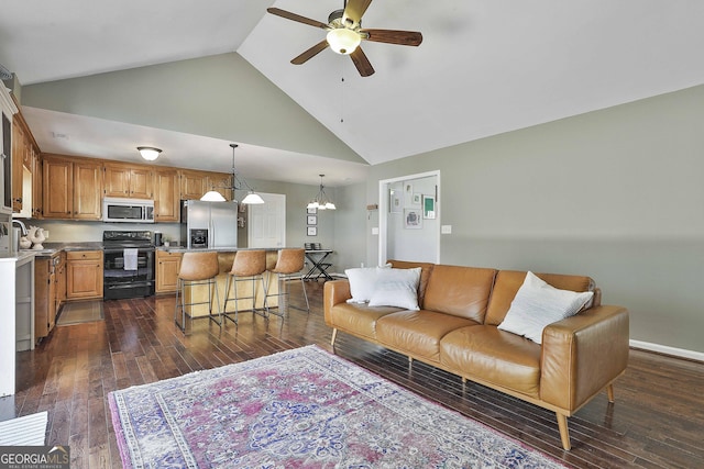 living room featuring dark wood-style floors, ceiling fan with notable chandelier, baseboards, and high vaulted ceiling