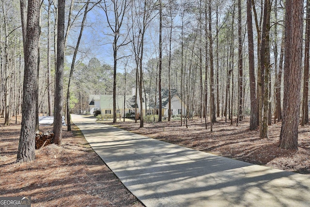 view of home's community featuring driveway