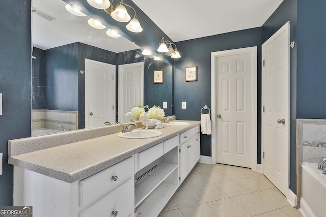 bathroom with tile patterned floors, double vanity, visible vents, and a sink