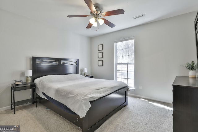 bedroom with visible vents, a ceiling fan, baseboards, and carpet floors