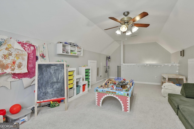 recreation room featuring baseboards, a ceiling fan, carpet flooring, and vaulted ceiling