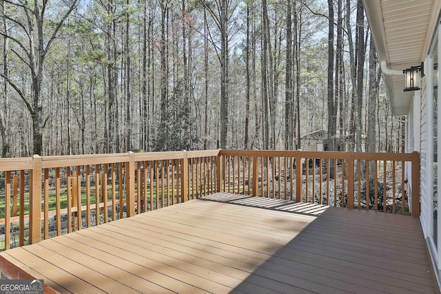 deck featuring a wooded view