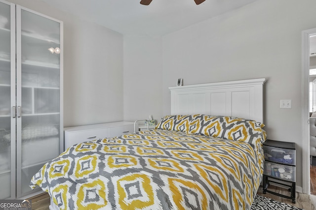 bedroom with wood finished floors and ceiling fan