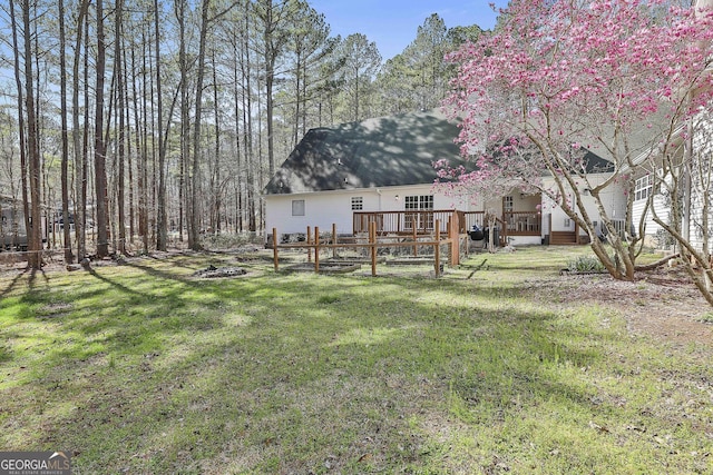 view of yard with a deck