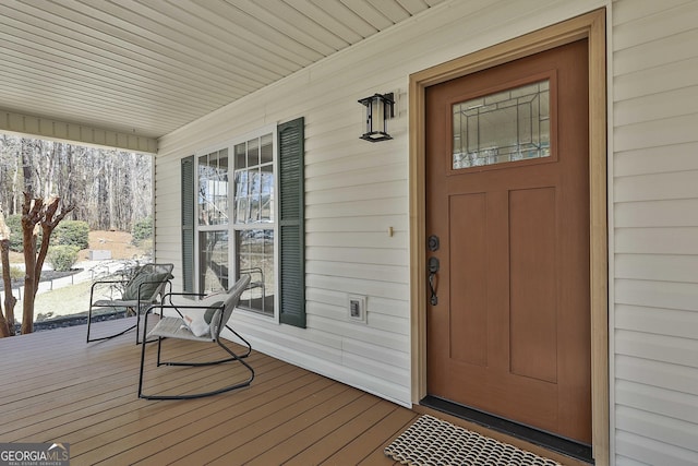 doorway to property with a porch