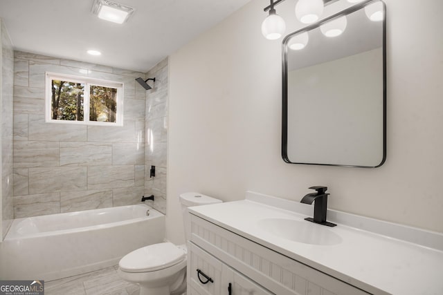 bathroom featuring shower / bath combination, vanity, and toilet