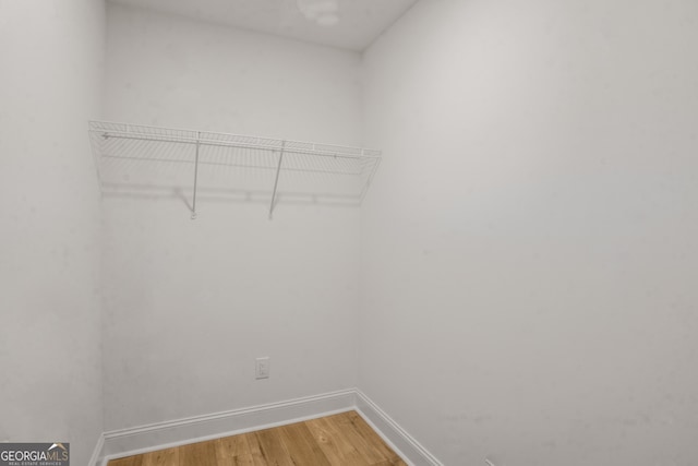 walk in closet featuring light wood-style floors