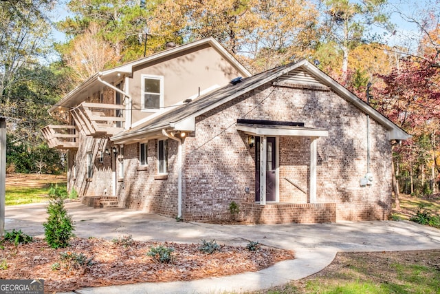 view of front of house with brick siding