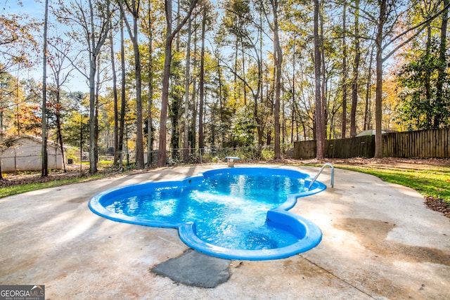 view of pool with a patio area and a fenced backyard