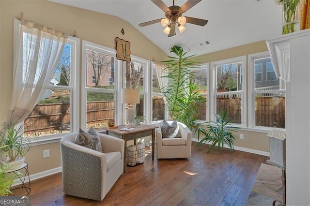 sunroom with vaulted ceiling, visible vents, and a ceiling fan