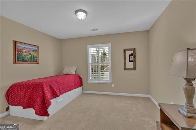 bedroom featuring carpet floors, visible vents, and baseboards