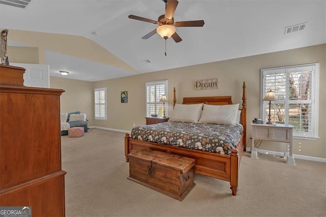 bedroom featuring light carpet, vaulted ceiling, visible vents, and baseboards