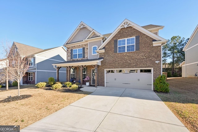 craftsman house featuring driveway, a garage, brick siding, a porch, and a front yard