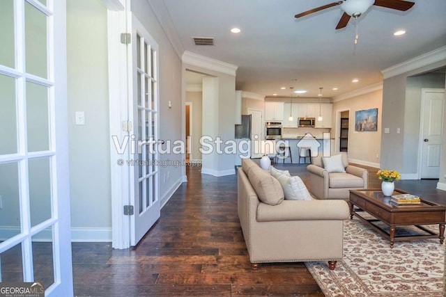 living room with baseboards, dark wood-style flooring, visible vents, and crown molding