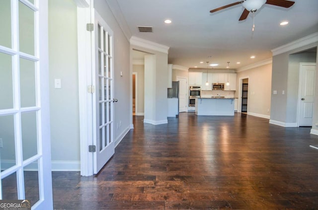 unfurnished living room with ornamental molding, dark wood-style flooring, and visible vents