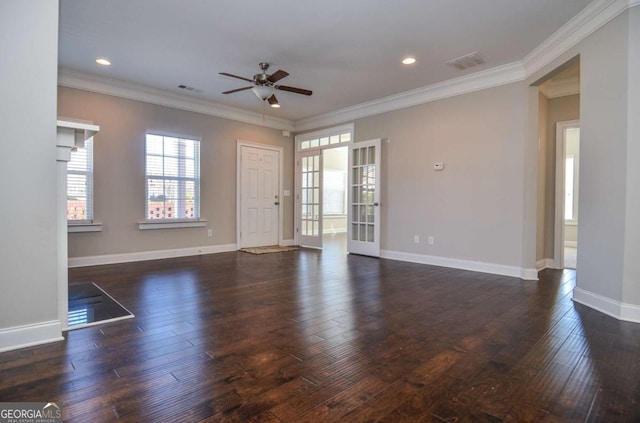 unfurnished living room with ornamental molding, dark wood-style flooring, visible vents, and baseboards