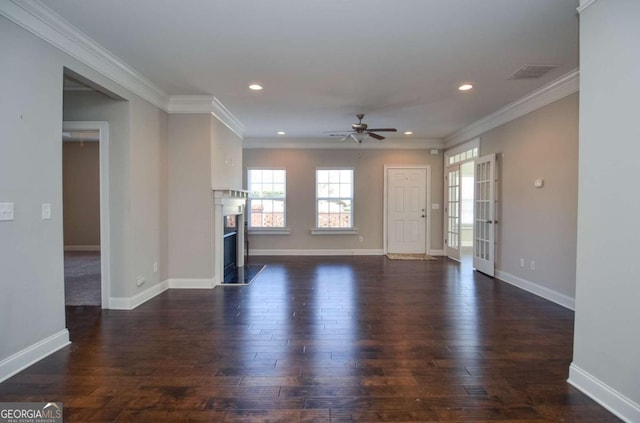 unfurnished living room featuring visible vents, ornamental molding, dark wood-style flooring, a fireplace, and recessed lighting