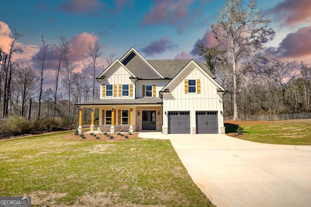 modern farmhouse with a garage, concrete driveway, covered porch, board and batten siding, and a front yard