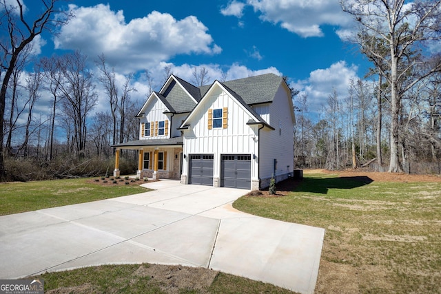 modern inspired farmhouse featuring driveway, a shingled roof, an attached garage, a front lawn, and board and batten siding